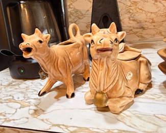 Vintage ceramic cow creamers and figurines