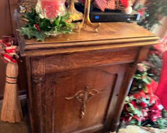 Wood nightstand, Christmas floral arrangement, Bluetooth speaker