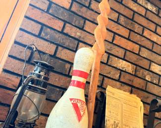 Vintage bowling pin and antique lantern