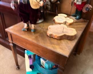 Christmas caroler figurines, live edge wood slab, drop leaf table