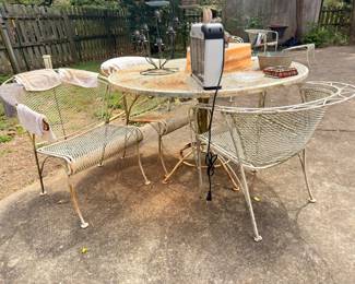 White wrought iron patio table and chairs set