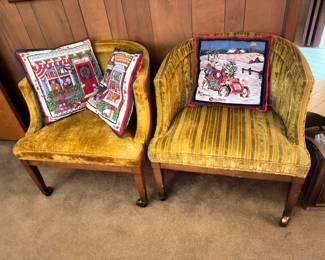Vintage gold upholstered arm chairs with Christmas throw pillows