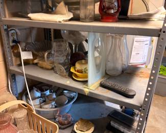 Garage shelving with vintage lantern, tools, and hardware