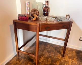 Mid-century console table with drawer, glassware, decor