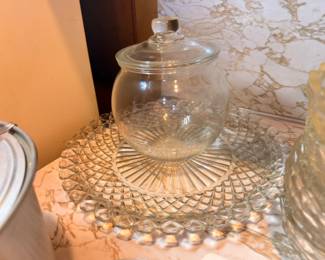 Glass cookie jar with lid and pressed glass serving dish