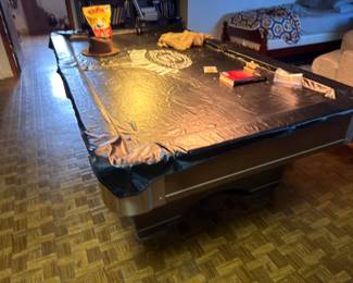 Large dark wood dining table with assorted items