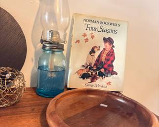 Norman Rockwell book, blue Ball mason jar, oil lamp, wooden bowl