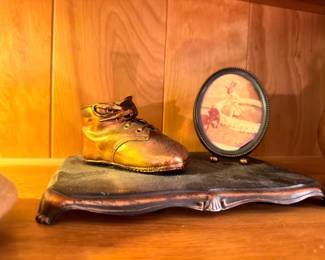 Antique bronze baby shoe and oval portrait frame