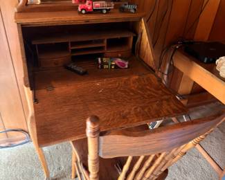Antique wooden writing desk with chair and vintage toy truck
