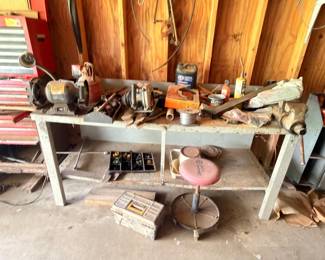 Metal workbench with bench grinder vise and power tools