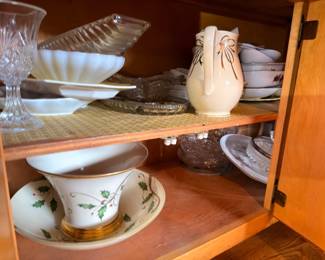 Ceramic pitcher, white serving dishes, glass compotes, and china collection