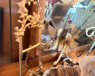 Ornate brass easel stand and brass decor