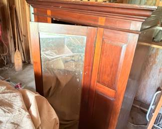 Cherry wood armoire cabinet with crown molding