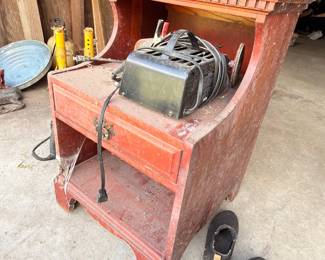 Vintage red metal tool chest with tools