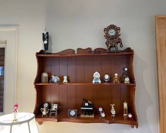 More small clock collection on shelf
