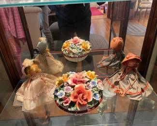 Two storybook dolls, bone china flowers