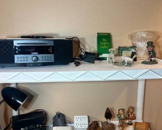 Audio & Small Collectibles – Cambridge SoundWorks radio/CD player, Hummel-style figurines, vintage camera, and crystal decorative accents