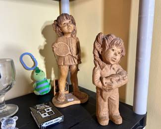 Sandicast-style figurines of a young tennis player and a girl with a puppy, shown alongside vintage playing cards