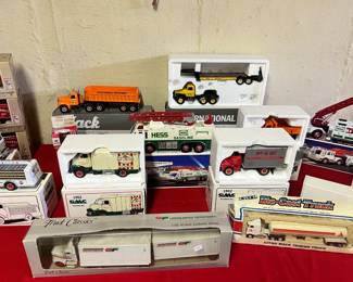 Professional Grade Replicas – Exceptional GMC, Mack, and International die-cast trucks, including a detailed 1952 GMC Insulated Van and state-highway department dump trailers