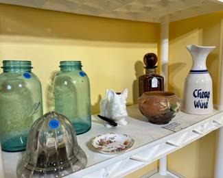 Antique aqua glass Ball canning jars, a "Cheap Wine" ceramic decanter, and a white terrier figurine