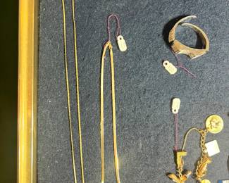 Jewelry: 14K gold chains, charms, bracelets, and vintage brooches