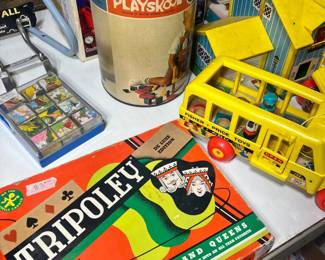 Classic Board Games & Fisher-Price – Nostalgic playtime favorites including a vintage 1960s Playskool wooden block tube, the iconic Fisher-Price School Bus, and a classic Deluxe Tripoley board game
