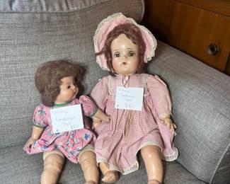 Two mid-century composition dolls with original clothing