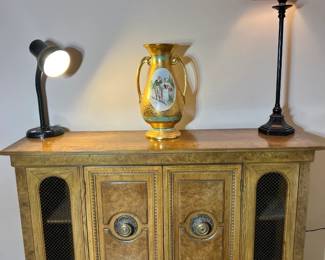 Burl wood grain buffet featuring mesh-front side doors, ornate brass hardware, and a hand-painted gold-handled urn.