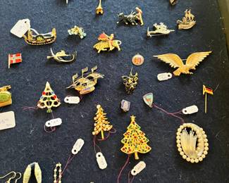 Jewelry: 14K gold chains, charms, bracelets, and vintage brooches