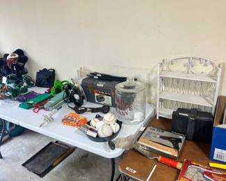 Workshop & Utility Lot – White wicker shelf, Black & Decker power drill, vintage clothing irons, golf clubs, and extension cords