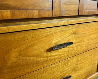 A stunning Mid-Century Modern double dresser featuring a distinctive woven wood facade on the top drawers and original brutalist-style hardware
