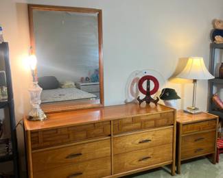 A stunning Mid-Century Modern double dresser featuring a distinctive woven wood facade on the top drawers and original brutalist-style hardware
