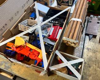 Box of Texaco and Roadway trucks, vintage wooden logs