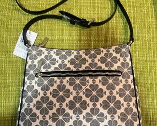 This is a Kate Spade bag that is new with its original tags attached and original stuffing inside