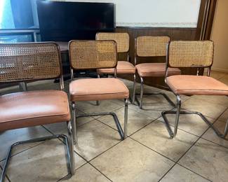 Six mid-century cane back and leather chairs