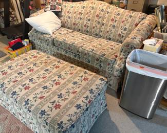 . . . upholstered couch and matching ottoman