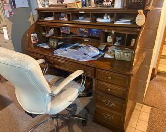 . . . office chair and rolltop desk