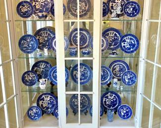 The white china cabinet (with blue willow china inside) pictured that is not being sold. The cabinet belongs to the family.