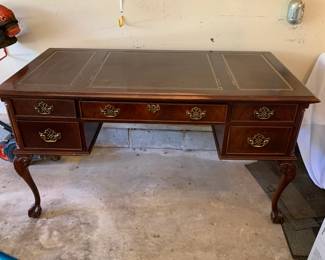 #218	leather top desk with 5 drawers ball and claw feet 56x28x30	 $100.00 
