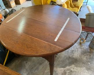 #204	round table wood  with division as is come apart 5 legs  45x29 	 $126.00 