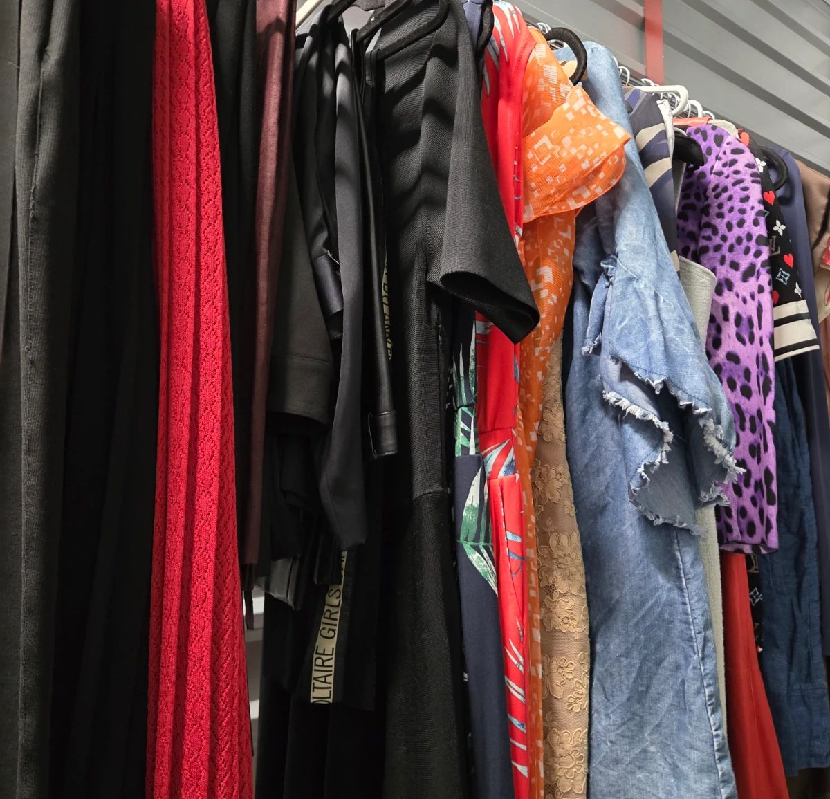 Racks of designer dresses, many with tags