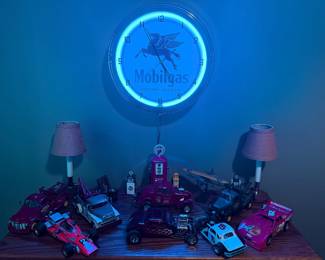 Contemporary Mobilgas clock and model cars 