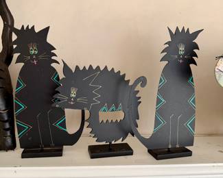 Trio of metal cat sculptures signed by Claudine Buell