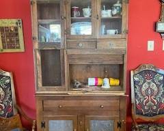 Fiesta clock on wall, two of six dining chairs
