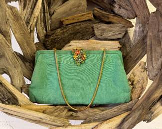 Vintage teal purse with metal flower clasp