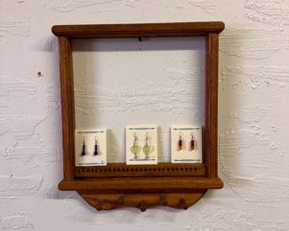 Trio of new earrings with wooden holder