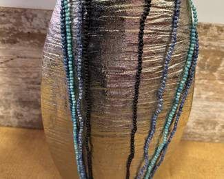 Four strands of small beads