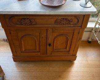Marble top chest. With one drawer and a cabinet hiding one shelf. 34 inches wide by 18 1/2 inches deep by 30.5 inches high.