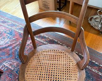 One of several caned seat sides chairs in the sale during in-person shopping hours.