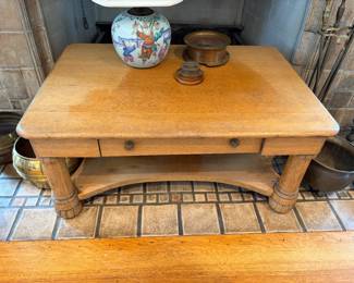 $120.  Pine coffee table with as found sun-fading on the top.  One drawer and shelf.  38"w x 26.5"d x 17.5"h.